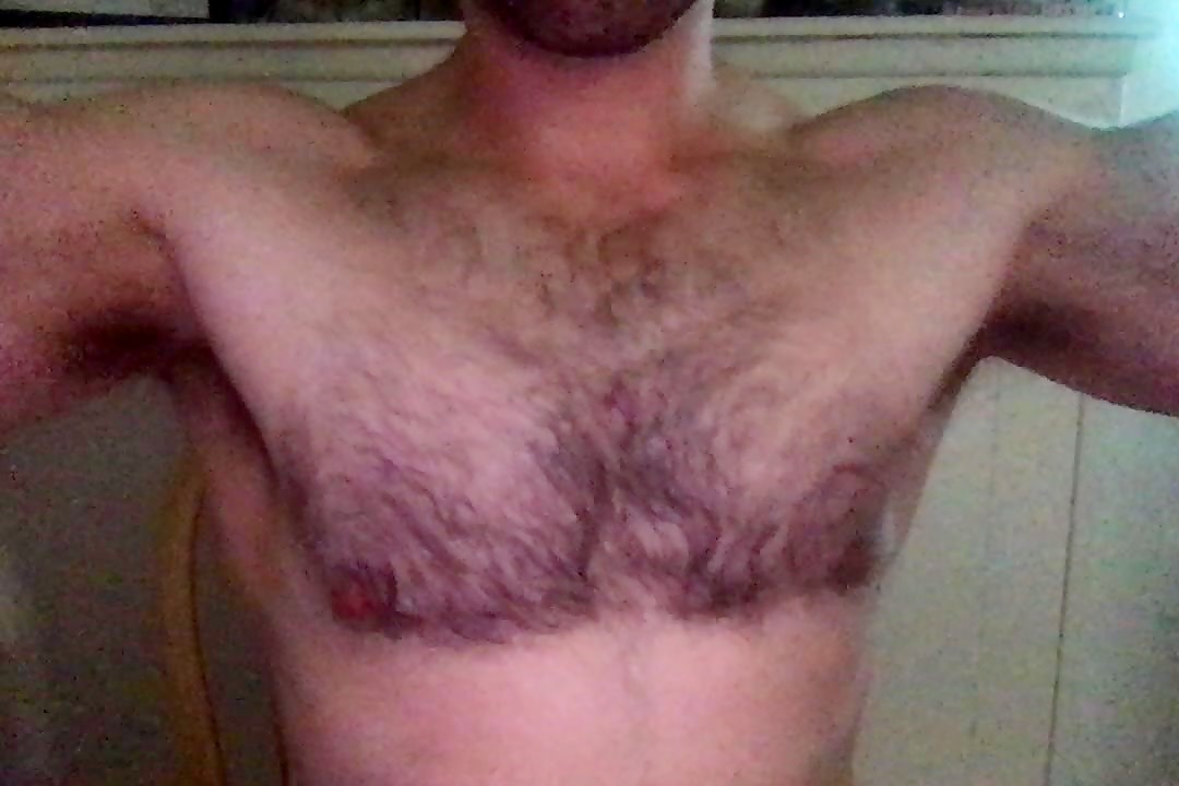Muscular hairy daddy flexes and two-hand jerks his fat cock to a cumshot
